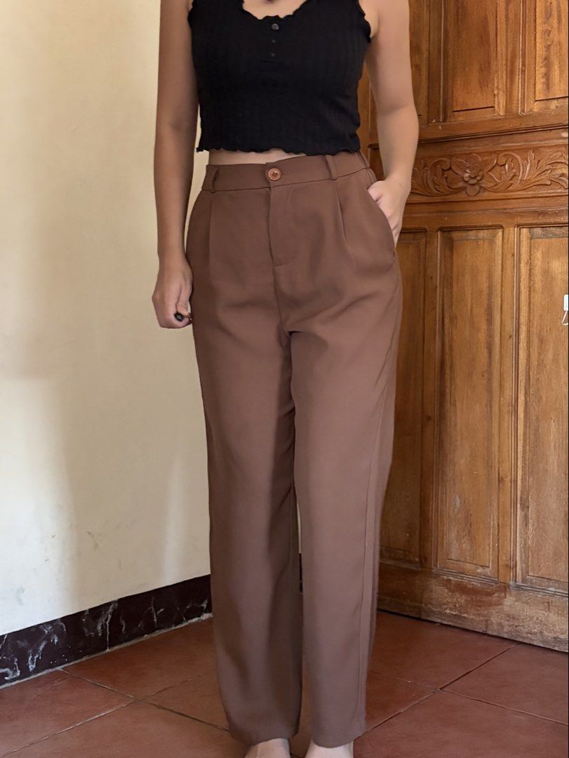 Brown high-waisted pleated trousers with button closure (Category: Trousers) located in Pasig City. Submitted by catherinea38704 (Listing ID 1468627202, Image 3). Description: - Style: High-waisted wide-leg trousers with front pleats - Color: Brown - Features: Functional side pockets and secure button closure - Condition: Worn a few times, excellent fabric quality - Status: Clean, washed, and ready to wear Waistline: 25-26 inches Location: Caniog