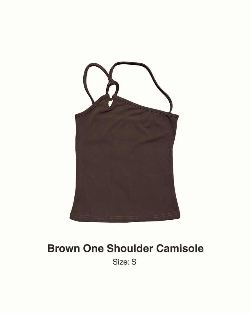 Brown One Shoulder Camisole Size S (Category: Sleeveless) located in Manila. Submitted by maaya.rikit (Listing ID 1468622104, Image 1). Description: - Color: Rich brown - Original price: 448 - Style: One-shoulder camisole with unique strap and ring detail - Fit: Fitted silhouette with stretchy, smooth fabric - Versatility: Great for layering or wearing alone on warm days - Pairing: Easy to dress up with jeans or a skirt .