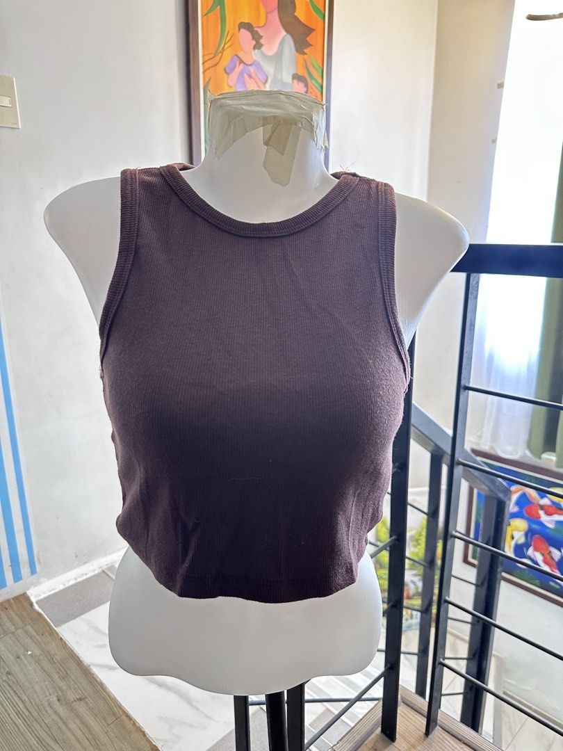 Brown Ribbed Crop Tank Top Sleeveless (Category: Sleeveless) located in Manila. Submitted by rachael_23 (Listing ID 1468527156, Image 1). Description: - Color: Brown - Material: Soft stretch cotton - Design: Ribbed texture, round neckline, sleeveless - Fit: Fitted crop top - Style Tip: Perfect match for high-waisted jeans or shorts for an easy casual look.