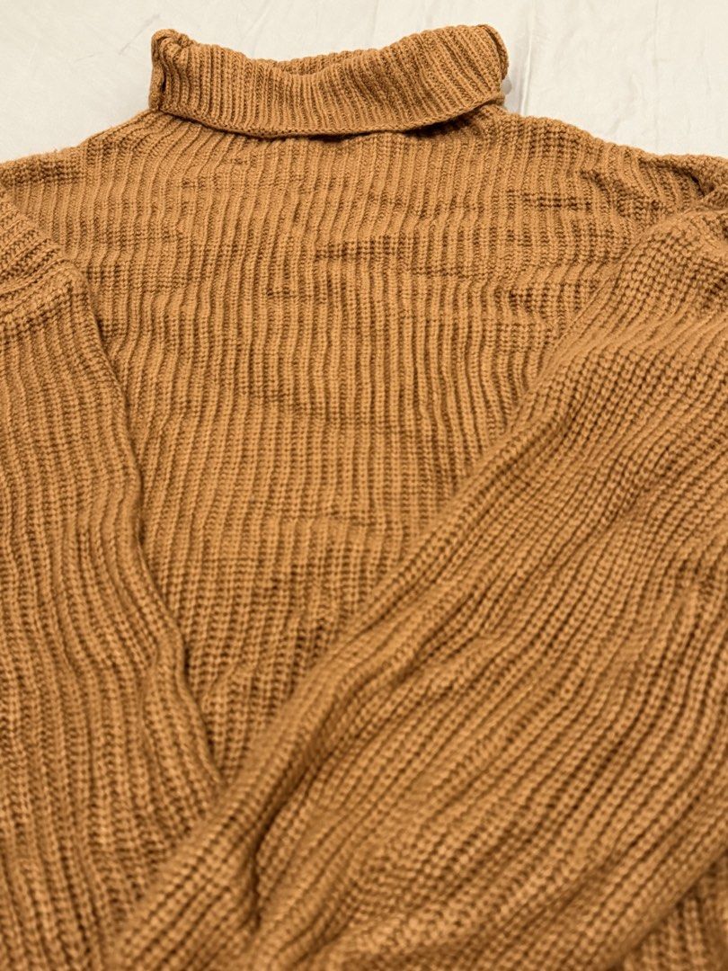 Brown Ribbed Turtleneck Oversized Sweater (Category: Coats, Jackets and Outerwear) located in Taguig. Submitted by aikaintongva (Listing ID 1468606074, Image 2). Description: - Color: Warm caramel brown - Material: Soft and chunky knit - Fit: Relaxed fit with dropped shoulders and long sleeves - Details: Heavy ribbed texture and thick rolled collar - Season: Ideal for autumn and winter layering.
