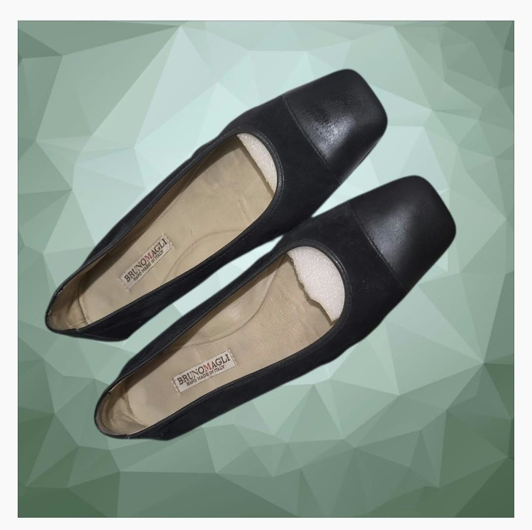 Bruno Magli Black Leather Square Toe Flats (Category: Flats & Sandals) located in Paranaque City. Submitted by calm_youngstore7 (Listing ID 1468593413, Image 1). Description: - Brand: Bruno Magli - Origin: Handmade in Italy - Material: Smooth leather cap toe with soft suede-like body and tan leather inner lining - Design: Square toe, low stacked heel, slip-on style - Condition: Soles show light wear with debossed logo pattern - Perfect for: Comfo