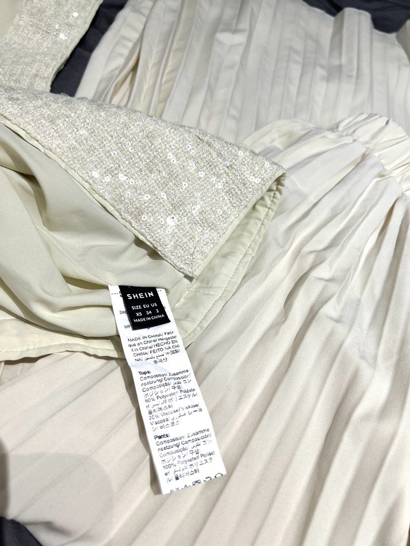 Bundle: Office outfit set (Off-white) (Category: Others Tops) located in Quezon City. Submitted by maekuuh (Listing ID 1468660963, Image 3). Description: Set 1: Top+Pleated Pants Off-White Sequin Single-Breasted Vest & Pleated Wide-Leg Pants 2 Pieces Set,Elegant Summer Party Sparkly Outfit,Glamorous Christmas New Year Set 2: Khaki Vest Khaki V-Neck Sleeveless Front Button Vest, Business Casual Formal Attire For Women.