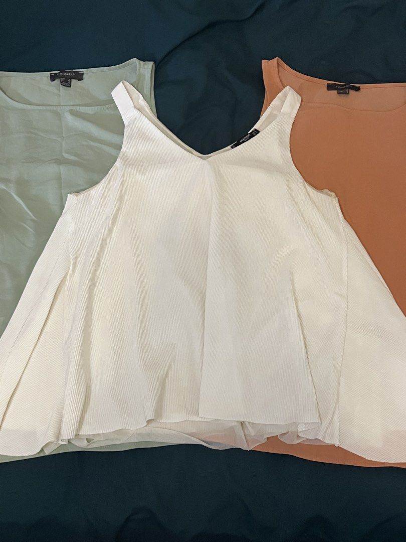 (BUNDLE) Top (Category: Sleeveless) located in Quezon City. Submitted by declutteringbyjam (Listing ID 1468556219, Image 1). Description: - preloved -medium to large -bundle for 400 -180 each -additional for sf.