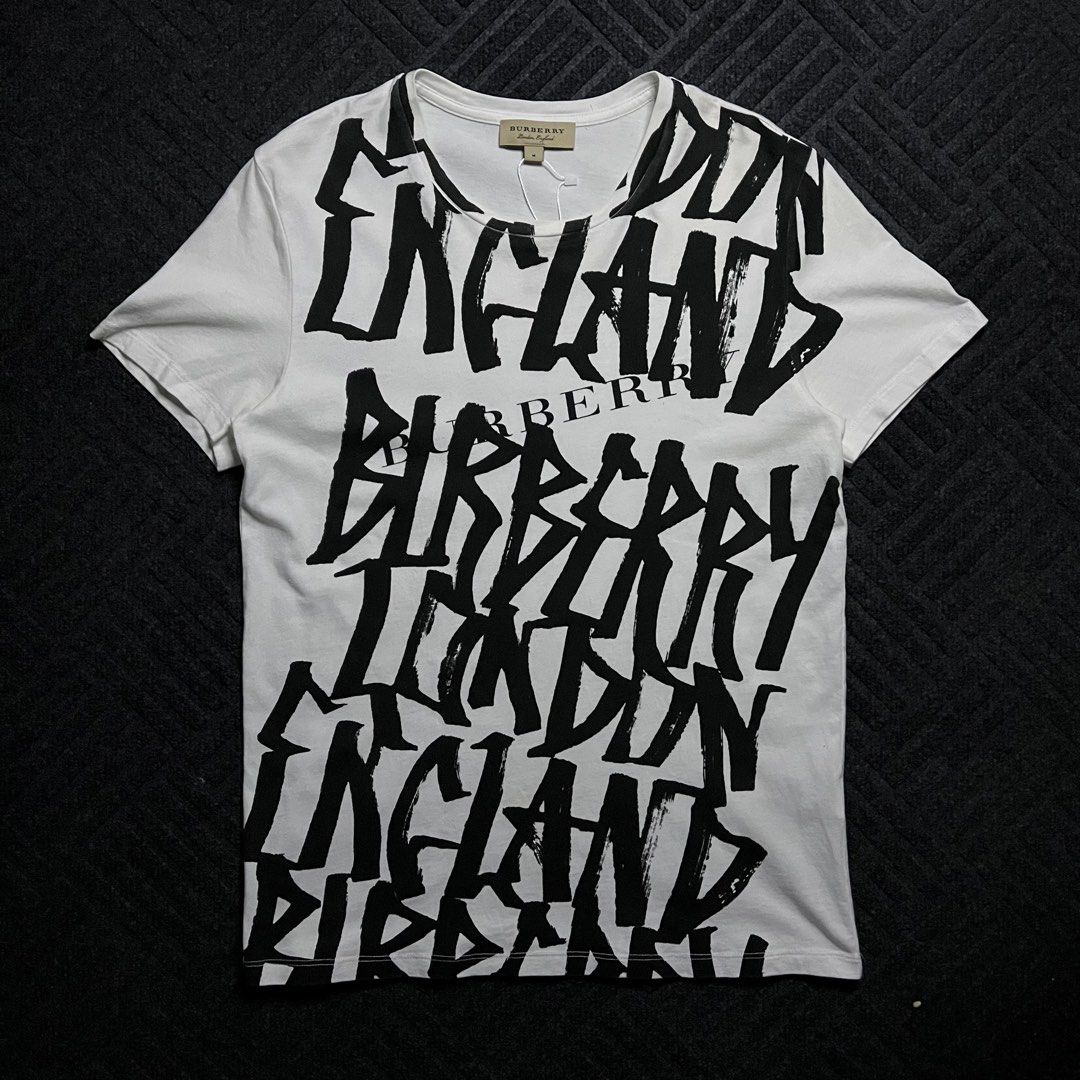 Burberry Grafitti Style Logo (Category: Shirts) located in Davao. Submitted by archived.status (Listing ID 1468580646, Image 1). Description: COLOR MAY VARY DUE TO LIGHTING‼️ Condition: 9.5/10 Color rate: 9.5/10, or better Issue: N/A Size Medium Width 19 Length 27.