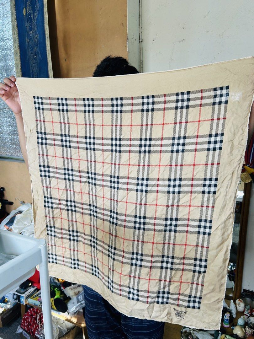 Burberry Nova Check Print Silk Scarf (Category: Scarves) located in Manila. Submitted by starbalesukandjapansurplus (Listing ID 1468597499, Image 3). Description: - Authentic Burberry silk twill scarf - Iconic nova check pattern in a versatile neutral beige color - Features the vintage 'Burberrys' London equestrian knight logo - Elegant hand-rolled edges - Square size, perfect for versatile styling - Timeless designer wardrobe essential.