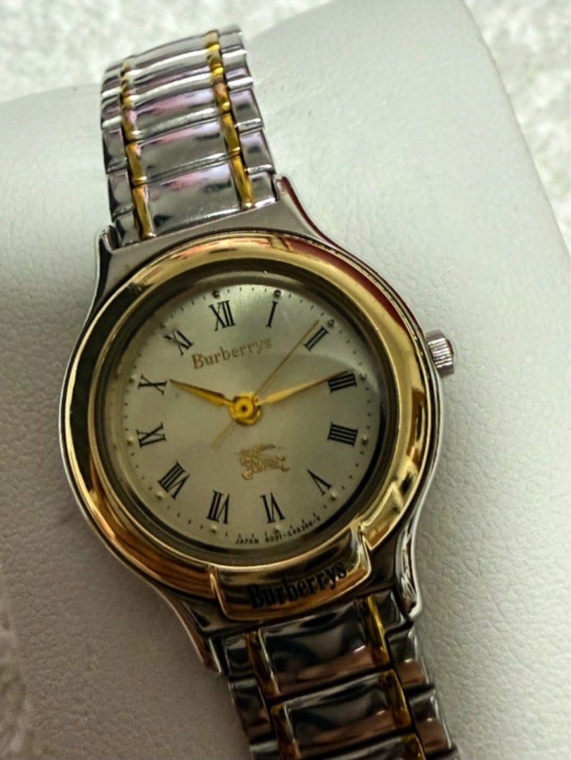 Burberrys Watch (Category: Luxury Watches) located in Quezon City. Submitted by liezl.marie (Listing ID 1468686500, Image 3). Description: Burb€rrys (two-tone gold and steel) quartz wristwatch, a white dial with Roman numeral hour markers and a gold-tone bezel. - In excellent condition -7.5 inches wrist size or smaller 5,500 Open for layaway. Disclaimer: We are not affiliated, associated, authorized, endorsed by or in any way officially connected