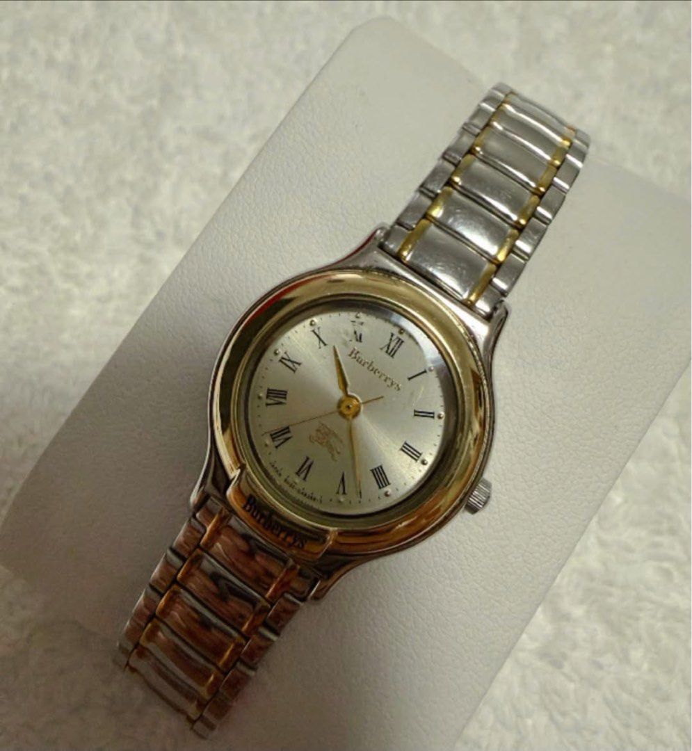 Burberrys Watch (Category: Luxury Watches) located in Quezon City. Submitted by liezl.marie (Listing ID 1468686500, Image 2). Description: Burb€rrys (two-tone gold and steel) quartz wristwatch, a white dial with Roman numeral hour markers and a gold-tone bezel. - In excellent condition -7.5 inches wrist size or smaller 5,500 Open for layaway. Disclaimer: We are not affiliated, associated, authorized, endorsed by or in any way officially connected