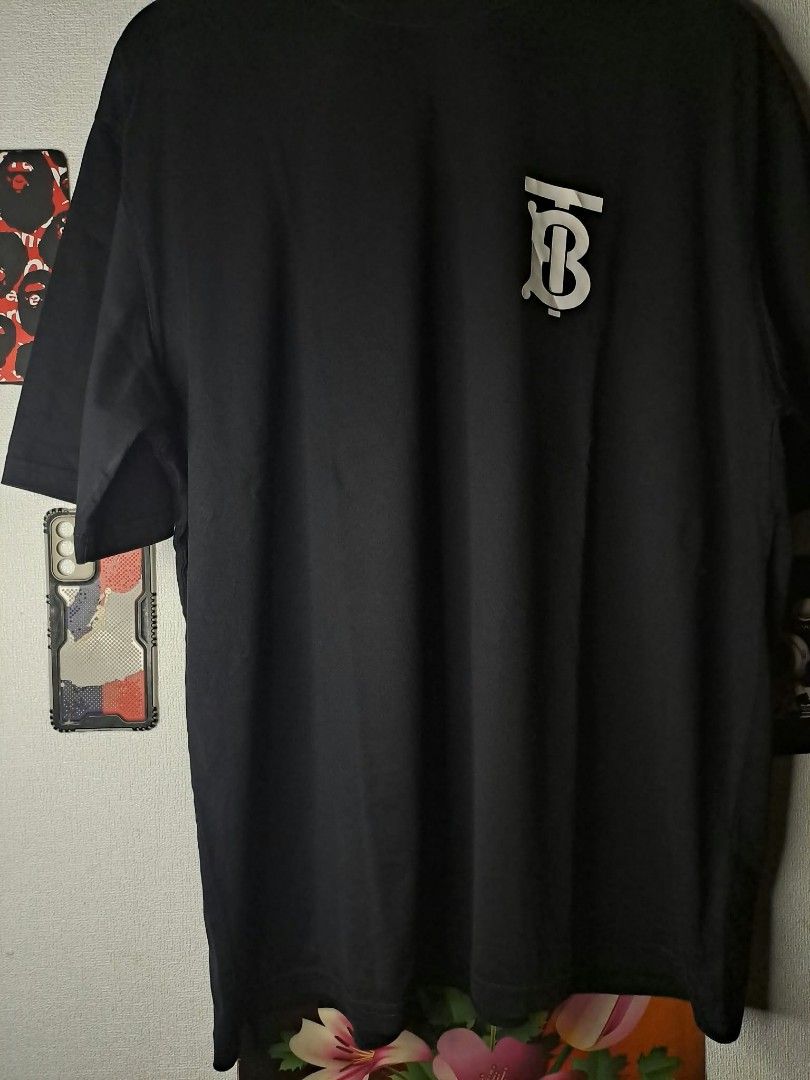 Burburry Emerson TB Monogram Chest Logo (Category: Luxury Apparel) located in Quezon City. Submitted by yaseen73 (Listing ID 1468709850, Image 3). Description: Authentic Burberry (TB) Thomas Burberry Monogram Logo Cotton Black Oversized T - Shirt Chest Logo Made in Portugal - Wearing Size : Large on Tags - Width '25 - Length '29 - Color Rate : 9.9/10 - Needs Wash - Nearly New Condition 🔥🔥🔥 PRE - OWNED 🔥🔥🔥 or Best Offer Courier : J&T Lalamov