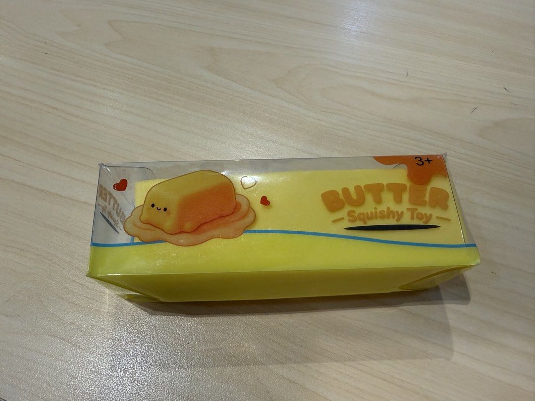 Butter Squishy Toy 4oz New In Box (Category: Kids Toys) located in Manila. Submitted by francisstein (Listing ID 1468513009, Image 3). Description: - Novelty butter stick slow-rising squishy toy - Net weight: 4 oz / 113g - Features 'salted butter' text on yellow foam body - Cute melted butter illustration on the packaging box - Great for stress relief, anxiety, or as a fun desk decoration - Brand new, unopened, and in original packaging - Perfect