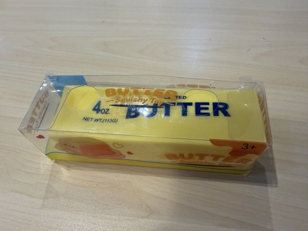 Butter Squishy Toy 4oz New In Box (Category: Kids Toys) located in Manila. Submitted by francisstein (Listing ID 1468513009, Image 2). Description: - Novelty butter stick slow-rising squishy toy - Net weight: 4 oz / 113g - Features 'salted butter' text on yellow foam body - Cute melted butter illustration on the packaging box - Great for stress relief, anxiety, or as a fun desk decoration - Brand new, unopened, and in original packaging - Perfect