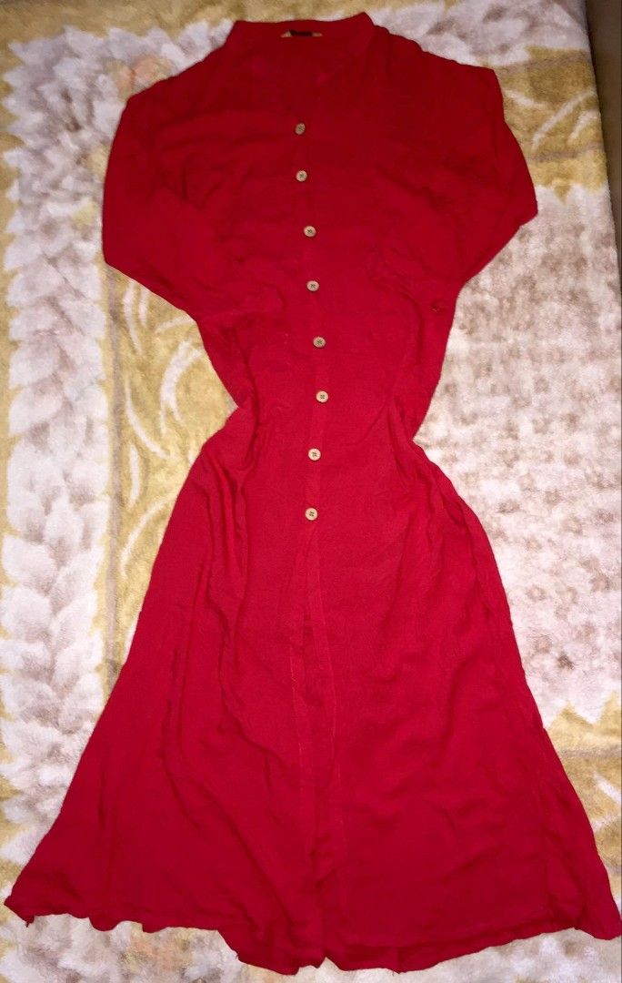 Button-Front Midi Dress (Category: Dresses) located in Dasmarinas. Submitted by pepperronnie (Listing ID 1468586351, Image 1). Description: This is a vibrant red button-front midi dress ❤️ Style Breakdown: - Collar: Mandarin / stand collar — clean & elegant ​ - Design: Full button-down front with natural wood-tone buttons ​ - Silhouette: Relaxed fit through top, gently flowing midi skirt — effortless & comfortable ​ - Sleeves: 3/4 length — perfec