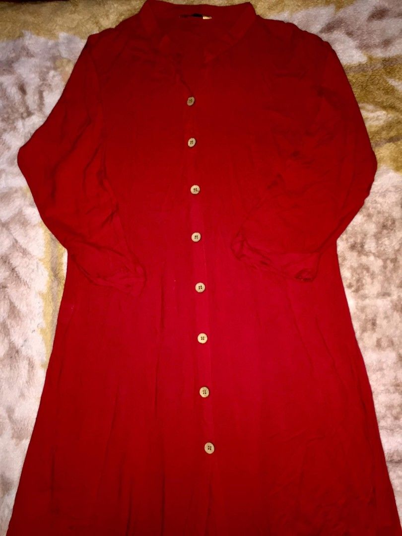 Button-Front Midi Dress (Category: Dresses) located in Dasmarinas. Submitted by pepperronnie (Listing ID 1468586351, Image 2). Description: This is a vibrant red button-front midi dress ❤️ Style Breakdown: - Collar: Mandarin / stand collar — clean & elegant ​ - Design: Full button-down front with natural wood-tone buttons ​ - Silhouette: Relaxed fit through top, gently flowing midi skirt — effortless & comfortable ​ - Sleeves: 3/4 length — perfec