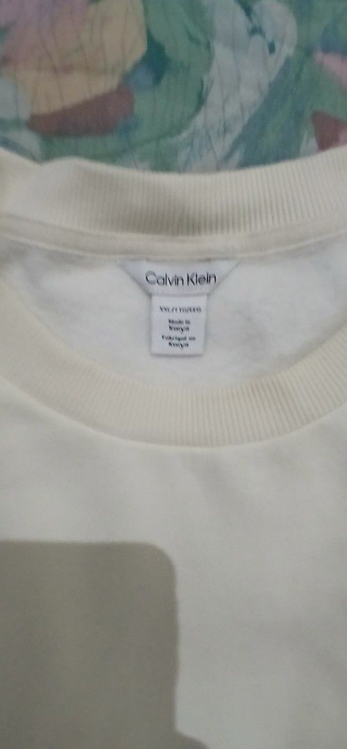 Calvin Klein 2XL sweatshirt (Category: Coats, Jackets and Outerwear) located in Marikina City. Submitted by darthvader888 (Listing ID 1468710489, Image 3). Description: - Brand: Calvin Klein - Color: Cream - Size: XXL (approx. 28" length, 28" pit-to-pit) - Material: Soft fleece interior for extra warmth - Details: Long sleeves, ribbed cuffs and hem, minimal branding - Condition: Clean with no major stains or flaws - Origin: Made in Kenya.
