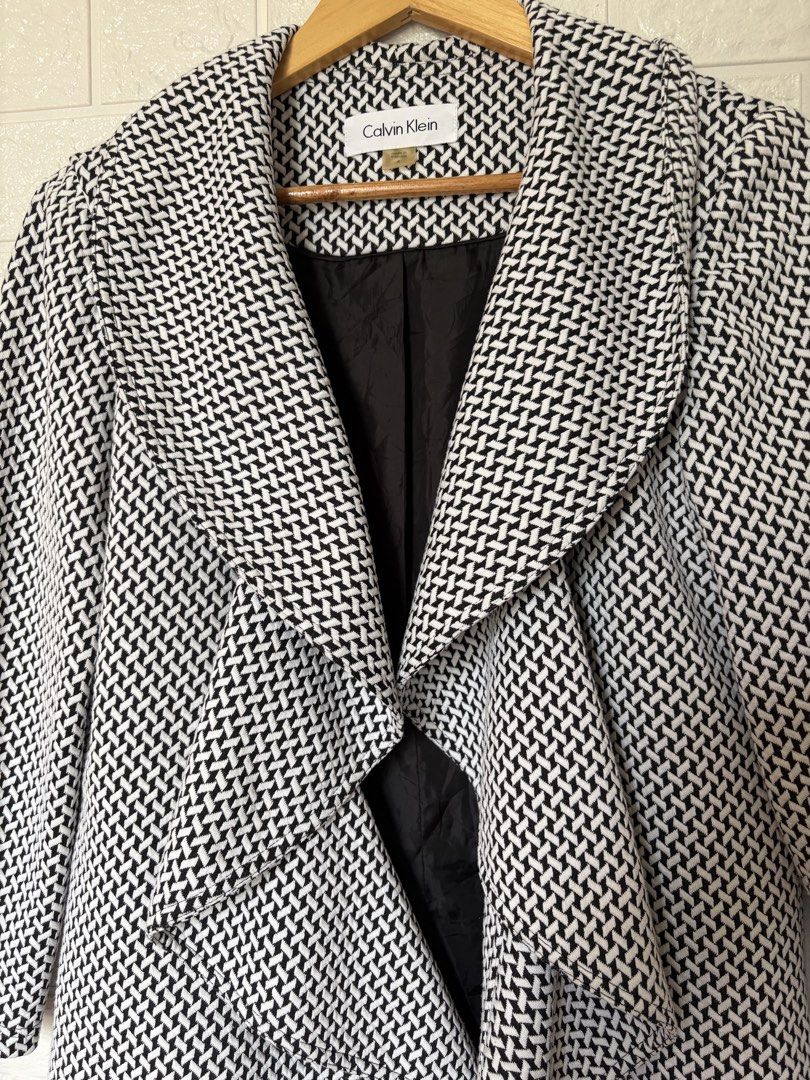 Calvin Klein Jacket Size 8 (Category: Coats, Jackets and Outerwear) located in Batangas. Submitted by purple_and_orange (Listing ID 1468515574, Image 2). Description: - Brand: Calvin Klein - Size: 8 (fits true to size) - Color/Pattern: Black and white geometric - Features: Waterfall lapel collar, structured shoulders, fully lined in black fabric - Length: Mid-length cut - Origin: Made in Vietnam - Condition: Excellent pre-loved condition - Perfec