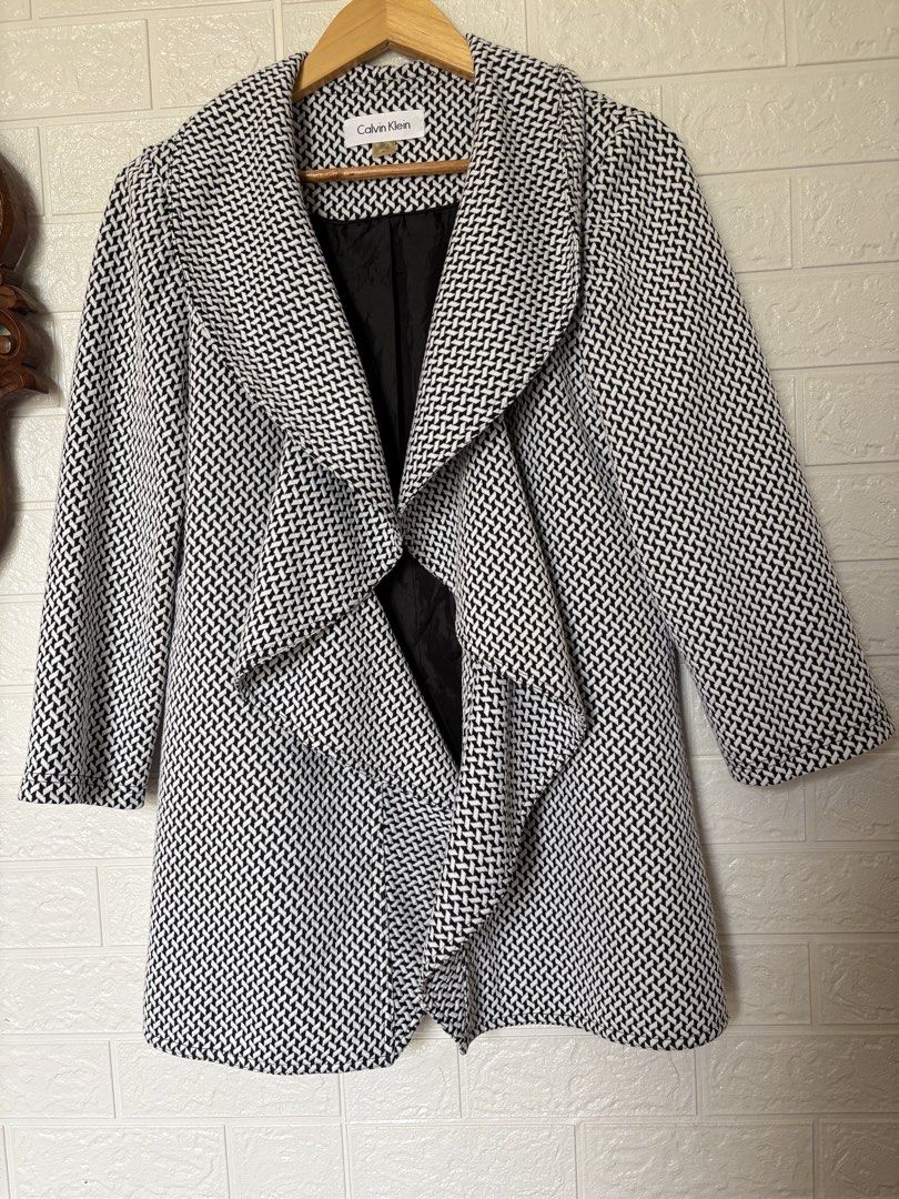 Calvin Klein Jacket Size 8 (Category: Coats, Jackets and Outerwear) located in Batangas. Submitted by purple_and_orange (Listing ID 1468515574, Image 1). Description: - Brand: Calvin Klein - Size: 8 (fits true to size) - Color/Pattern: Black and white geometric - Features: Waterfall lapel collar, structured shoulders, fully lined in black fabric - Length: Mid-length cut - Origin: Made in Vietnam - Condition: Excellent pre-loved condition - Perfec