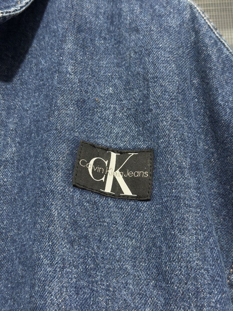 Calvin Klein Jeans Denim Bomber Jacket (Category: Coats, Jackets and Outerwear) located in Calumpit. Submitted by Essentiality (Listing ID 1468637873, Image 3). Description: Calvin Klein Jeans Denim Bomber Jacket 29x25 S on tag ₱2,500.