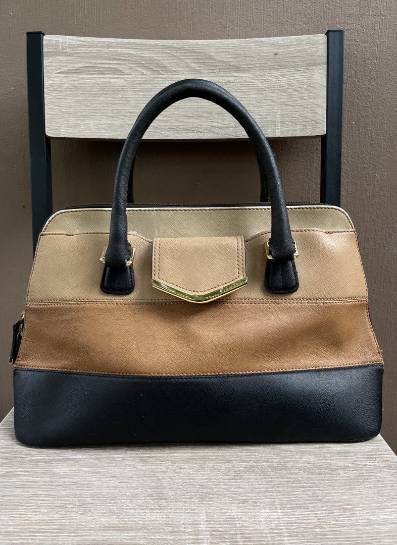 Calvin Klein Saffiano Satchel / Handbag (Category: Luxury Bags & Wallets) located in Limasawa. Submitted by ndifferance (Listing ID 1468573732, Image 1). Description: RFS: Has been stored inside the closet for years so need to unload to buy a brand new one 📌Dimes: Height 9 inches Length 15-16 inches Width 3.8 - 4.5 inches color rate Khaki | Beige | Black 9.5/10 Issue: Hairline cracks, creases, small peel off (see photos clearly to check the cond