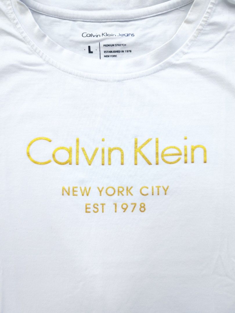 Calvin Klein Womens Tee (Category: Shirts) located in Bulacan. Submitted by emilj23 (Listing ID 1468521559, Image 2). Description: Calvin Klein Womens Tee Size L on tag L 23 W 17.5 Condition 9/10 Color rate 9/10 No Issue.