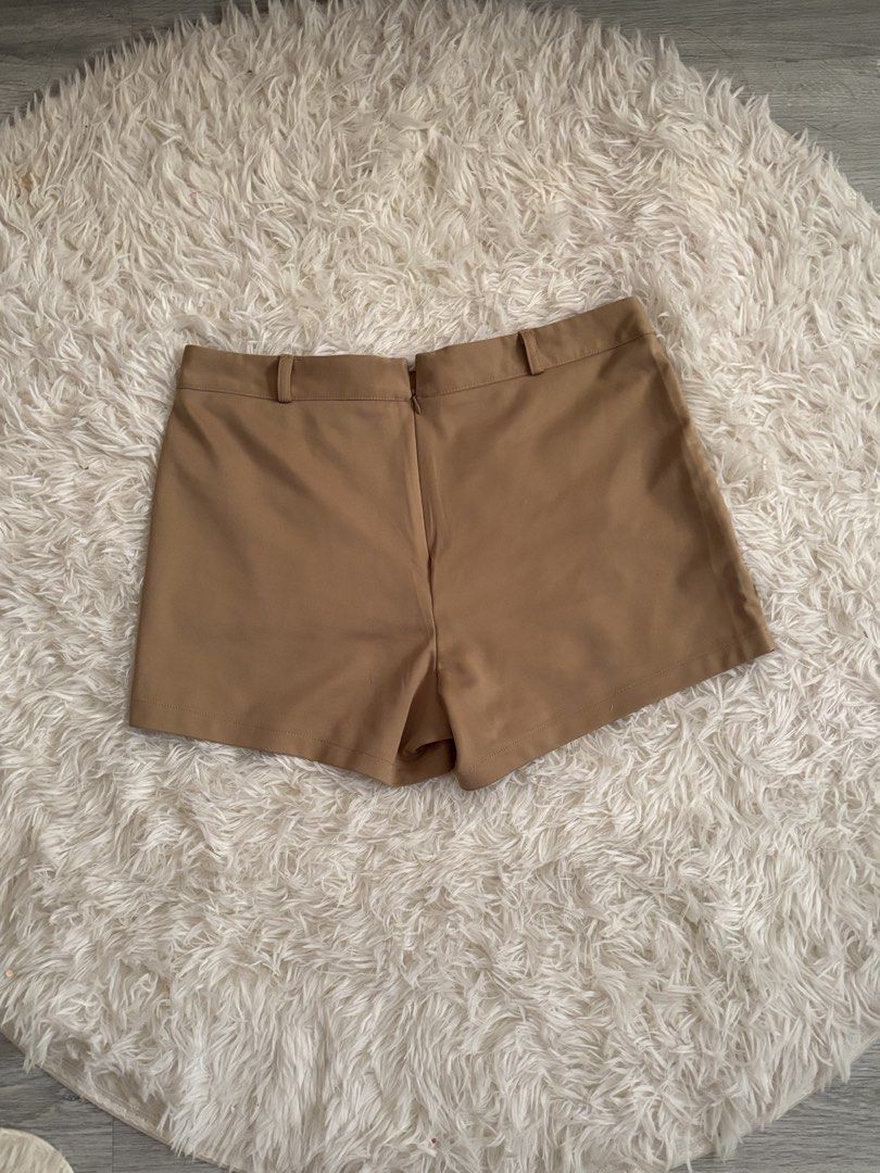 Camel Brown Casual Shorts with Front Pockets (Category: Shorts) located in Quezon City. Submitted by lovedbysloane (Listing ID 1468597420, Image 1). Description: - Color: Camel Brown - Style: Classic and versatile - Features: Two large front patch pockets, belt loops, and a structured waistband - Closure: Convenient back zip - Material: Smooth, high-quality fabric - Perfect for daily wear and easy to match with basic tops or blouses.