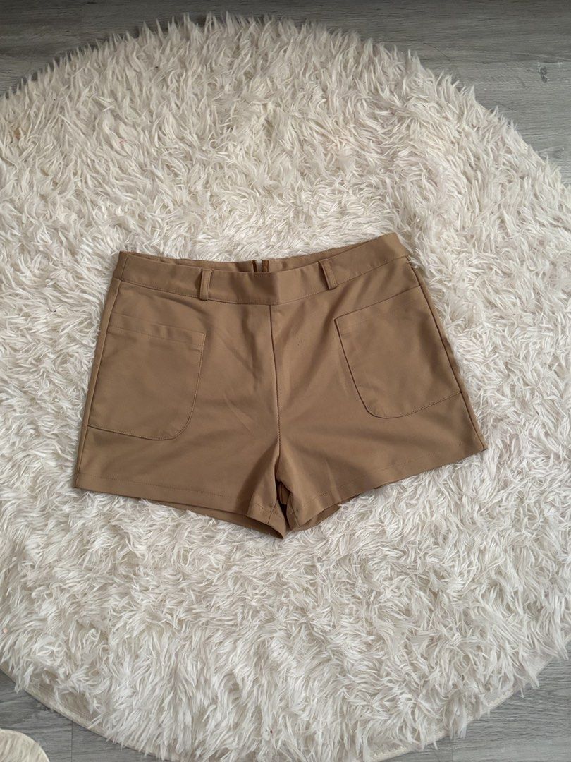 Camel Brown Casual Shorts with Front Pockets (Category: Shorts) located in Quezon City. Submitted by lovedbysloane (Listing ID 1468597420, Image 2). Description: - Color: Camel Brown - Style: Classic and versatile - Features: Two large front patch pockets, belt loops, and a structured waistband - Closure: Convenient back zip - Material: Smooth, high-quality fabric - Perfect for daily wear and easy to match with basic tops or blouses.