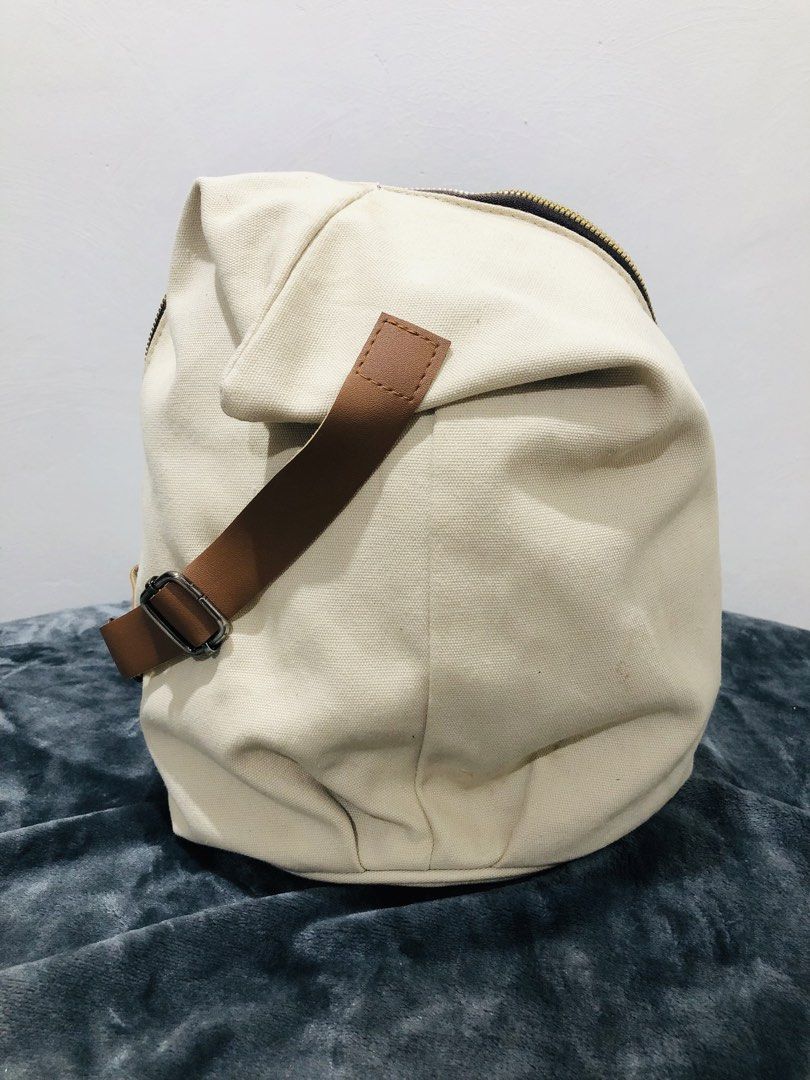 CANVAS DUMPLING BODY BAG (Category: Cross-body Bags) located in Imus. Submitted by dhouseoftotes (Listing ID 1468629367, Image 1). Description: 📐 MEASUREMENTS‼️ H - 14 inches W - 9 inches FROM JAPAN! IDEAL FOR EVERYDAY USE 1-OPEN POCKET INSIDE 1-ZIPPER POCKET (BACK) NEED WASH DISCLAIMER!! I am not affiliated, associated, authorised, endorsed by, or in any way officially connected with any of the brands, companies, or trademarks mentioned on this