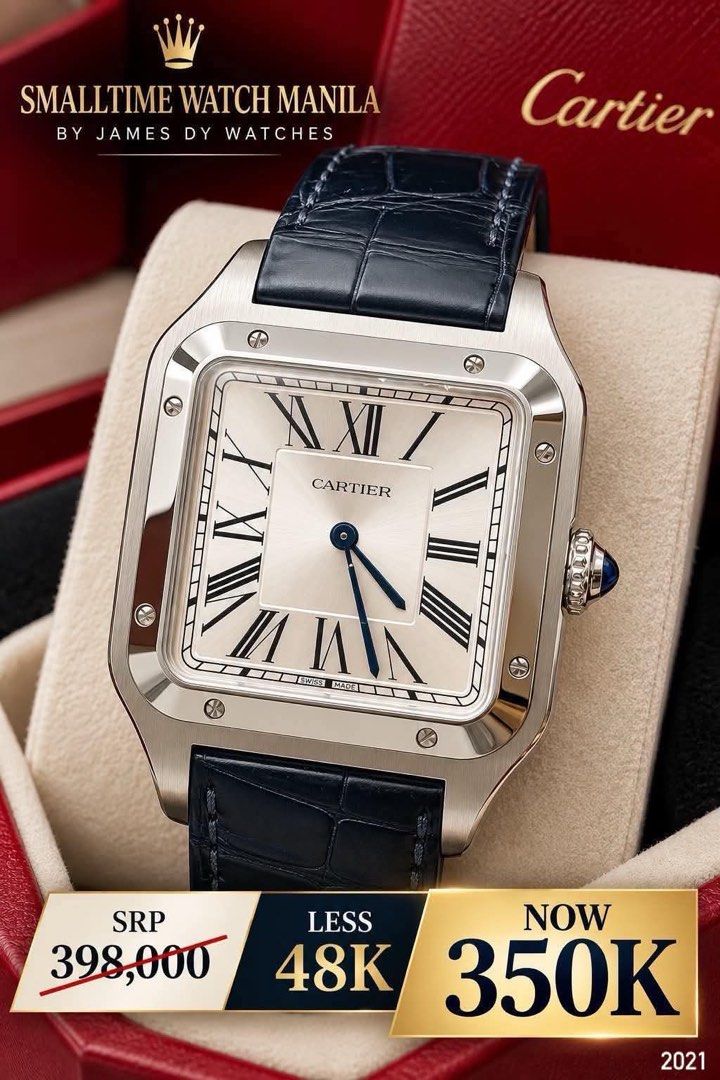 Cartier Santos Watch (Category: Luxury Watches) located in Manila. Submitted by watchesbyjamesdy (Listing ID 1468505905, Image 1). Description: - Brand/Model: Cartier Santos (2021 Model) - Material: Stainless steel case with dark blue leather strap - Dial: Silver with classic black Roman numerals and blue sword hands - Details: Signature sapphire cabochon on the crown - Movement: Swiss made - Inclusions: Complete with original box - Condition: Ex