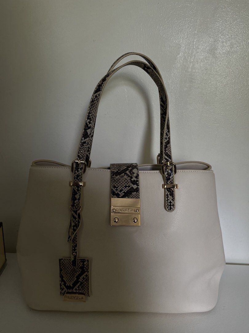 Carvela Midi Mandy Bone Snake Print (Category: Tote Bags) located in Manila. Submitted by irish_closet (Listing ID 1468548012, Image 2). Description: Flap-over magnetic closure, interior central zipped pocket, and dual top handles with a matching luggage tag - Never been used, with dust bag - Bought in London .