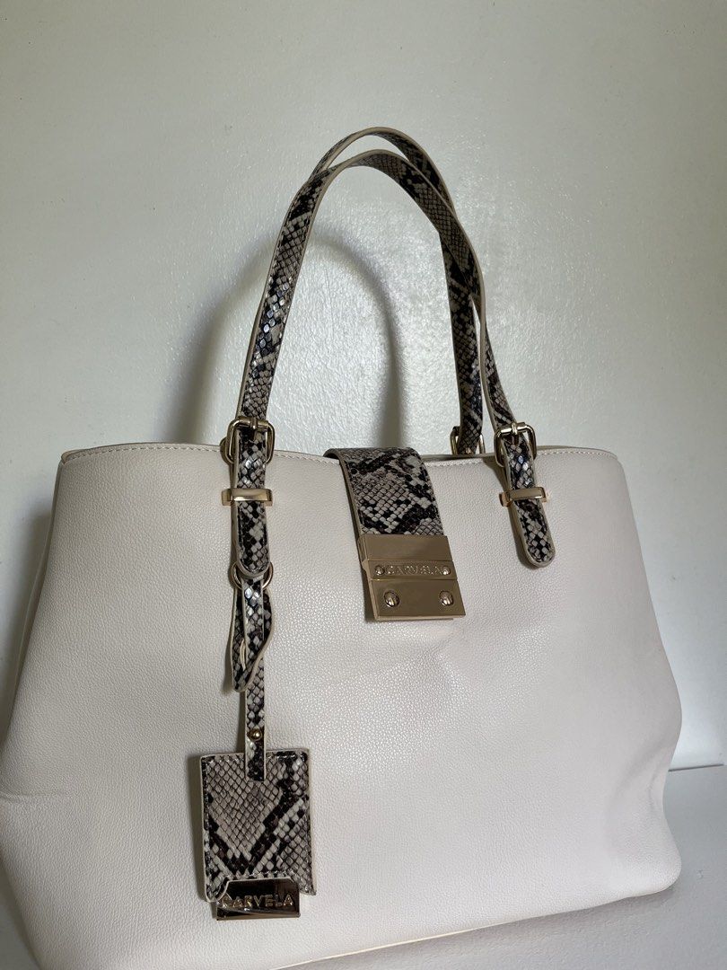 Carvela Midi Mandy Bone Snake Print (Category: Tote Bags) located in Manila. Submitted by irish_closet (Listing ID 1468548012, Image 3). Description: Flap-over magnetic closure, interior central zipped pocket, and dual top handles with a matching luggage tag - Never been used, with dust bag - Bought in London .