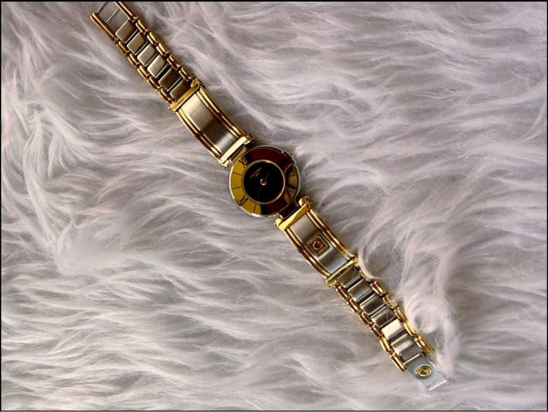 Carven Watch (Category: Men's Watches) located in Quezon City. Submitted by liezl.marie (Listing ID 1468686752, Image 2). Description: A Carv€n Paris two-tone (gold and silver) quartz women’s vintage watch with a black dial, Roman numerals, and a distinctive bangle-style bracelet. - In excellent condition - Complete links 5500 Open for layaway..