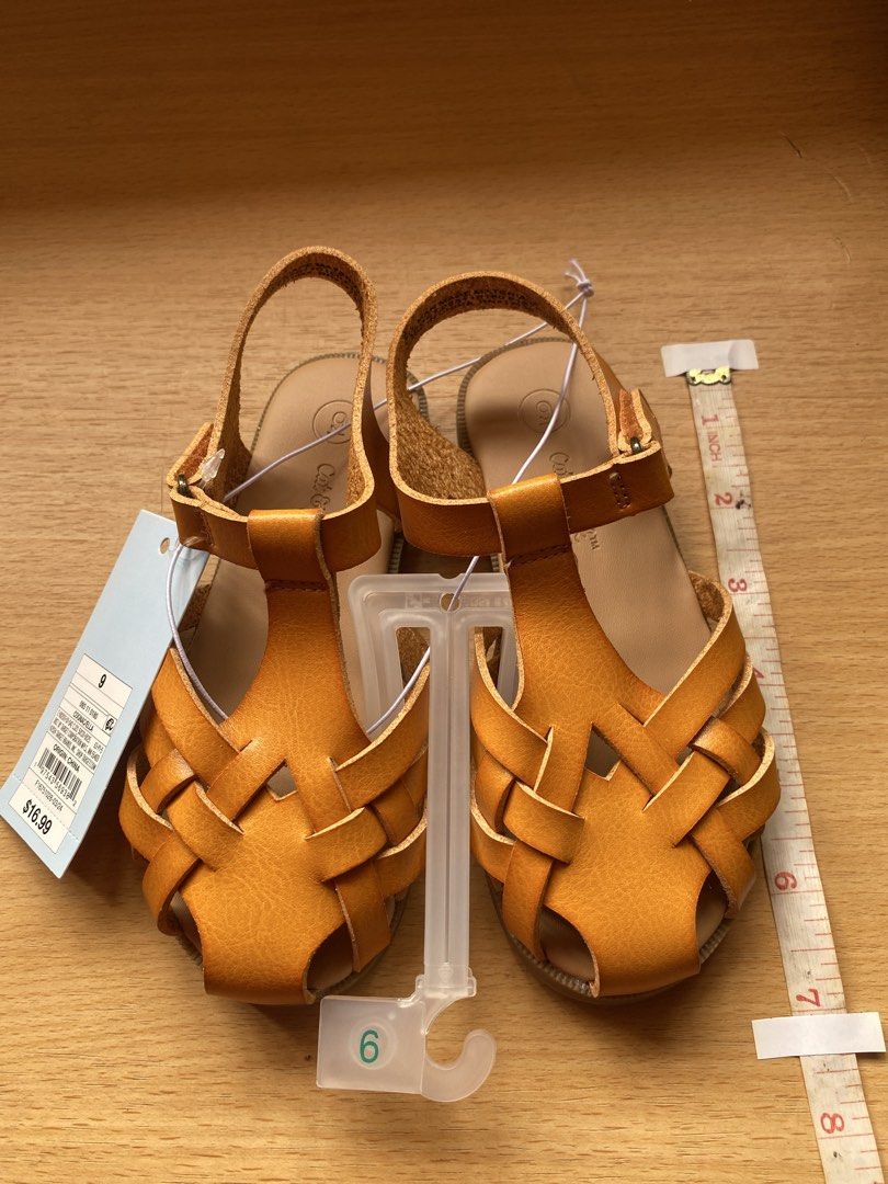 Cat & Jack Cognac Ella Sandals Size 9 (Category: Babies & Kids Fashion) located in Batangas. Submitted by lux_kimmy (Listing ID 1468587090, Image 3). Description: - Brand: Cat & Jack - Size: 9/ 15.5cm - Color: Cognac - Condition: Brand new with tags (BNWT) - Original Price: $16.99 - Design: Woven front strap with adjustable buckle ankle closure - Sole: Rubber with textured grip for safety - Perfect for everyday kid's wear and special occasions.