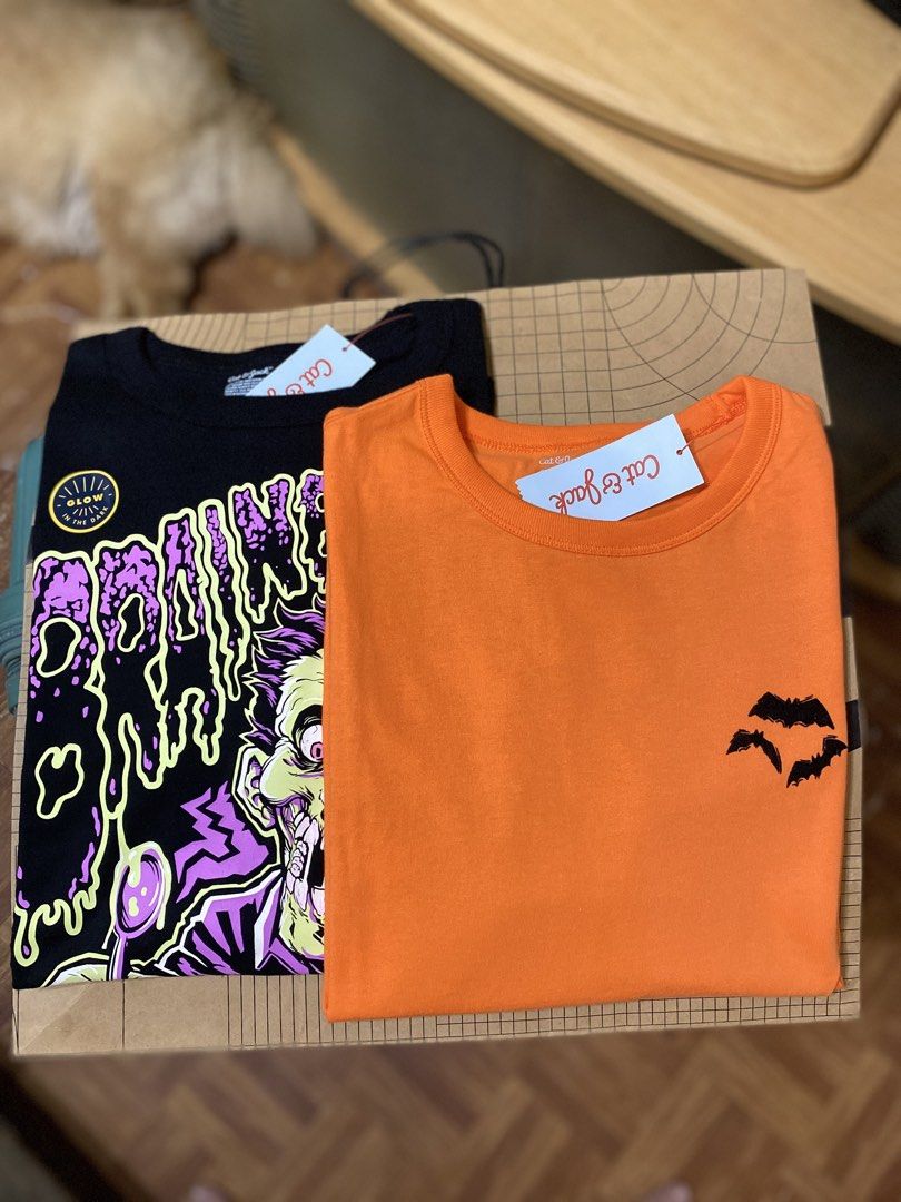 Cat & Jack Halloween Graphic T-Shirts Bundle - 2 Pack (Category: Shirts) located in Batangas. Submitted by lux_kimmy (Listing ID 1468708899, Image 1). Description: BUNDLE SPOOKY 👻 US Brands clothes for Halloween or for just being spooky 🎃 SET FOR ONLY ₱480+SF! 💸 Glow in the dark & The back details of the orange shirt 😮 Black Glow in the dark: BEST FIT: Mens (M-L) or Women’s (L-XL) Orange T-shirt: BEST FIT: Women’s (M-L) .