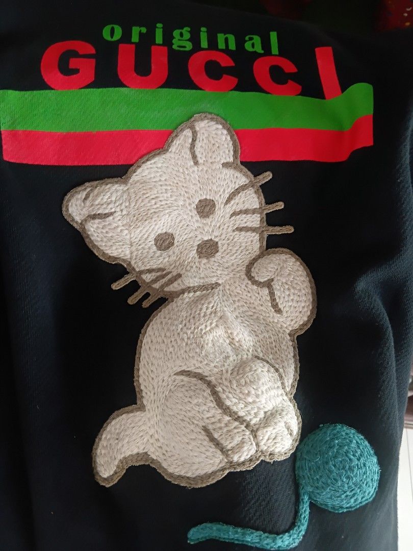 CatLogo Gucci (Category: Coats, Jackets and Outerwear) located in Subic. Submitted by AnythingBrandedby_May (Listing ID 1468648583, Image 2). Description: Fits Large 23X Gucci Cat Logo.