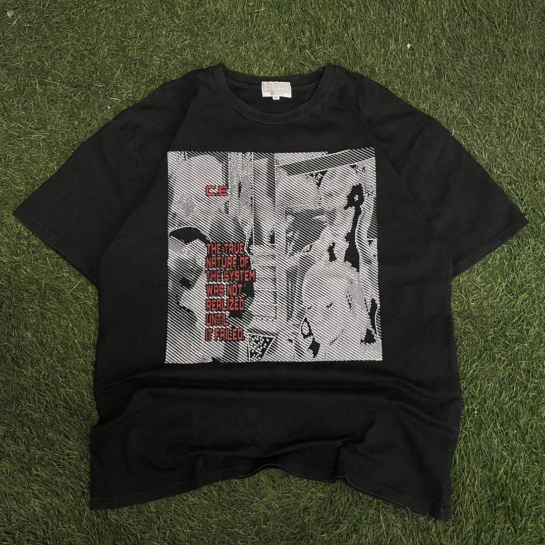 Cav Empt C.E. Graphic Tee (Category: Tshirts & Polo Shirts ) located in Pasig City. Submitted by icie_finds (Listing ID 1468622098, Image 1). Description: Cav Empt C.E. Graphic Tee SIZE: Tagged M (Fits Medium) DIMES: Width: 22.5 inches Length: 29 inches Style: Japanese streetwear graphic t-shirt featuring front halftone system artwork print and back shoulder branding. Color: Black Measurements: * Width: 22.5 inches * Length: 29 inches Condition: 