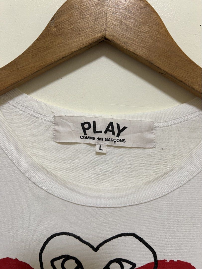 CDG Play White Multi Logo Design Shirt (Category: Luxury Apparel) located in Manila. Submitted by thriftpoint99 (Listing ID 1468690005, Image 2). Description: 20x28 Issue cut washtag only Excellent condition.