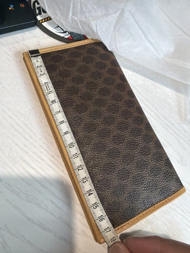 Celine Paris Triomphe Macadam Long Wallet Brown Tan (Category: Luxury Bags & Wallets) located in Makati City. Submitted by js0615 (Listing ID 1468278831, Image 3). Description: - Brand: Celine Paris (Made in Italy) -Vintage - Exterior: Brown canvas with iconic monogram and Triomphe motif - Interior: Smooth tan leather with clean lining and gold-stamped logo - Organization: Multiple card slots and cash compartments - Design: Slim profile, folds fl