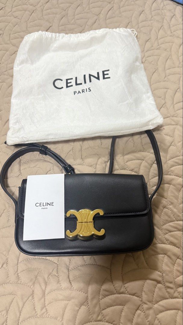 Celine Triomphe Black Leather Shoulder Bag (Category: Luxury Bags & Wallets) located in Makati City. Submitted by jianciee (Listing ID 1468509431, Image 1). Description: - Brand: Celine - Material: Premium black calfskin leather - Hardware: Elegant gold-tone hardware with front lock closure - Strap: Adjustable shoulder strap for versatile wear - Branding: Foil stamped logo under the front flap - Inclusions: Original white dust bag and paper tag i