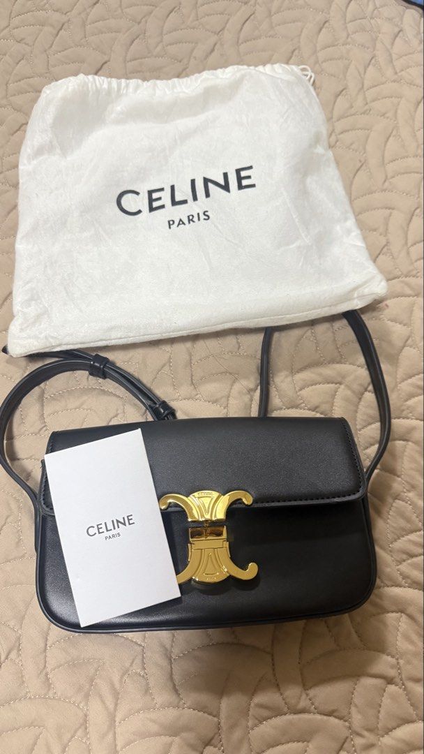 Celine Triomphe Black Leather Shoulder Bag (Category: Luxury Bags & Wallets) located in Makati City. Submitted by jianciee (Listing ID 1468509431, Image 2). Description: - Brand: Celine - Material: Premium black calfskin leather - Hardware: Elegant gold-tone hardware with front lock closure - Strap: Adjustable shoulder strap for versatile wear - Branding: Foil stamped logo under the front flap - Inclusions: Original white dust bag and paper tag i