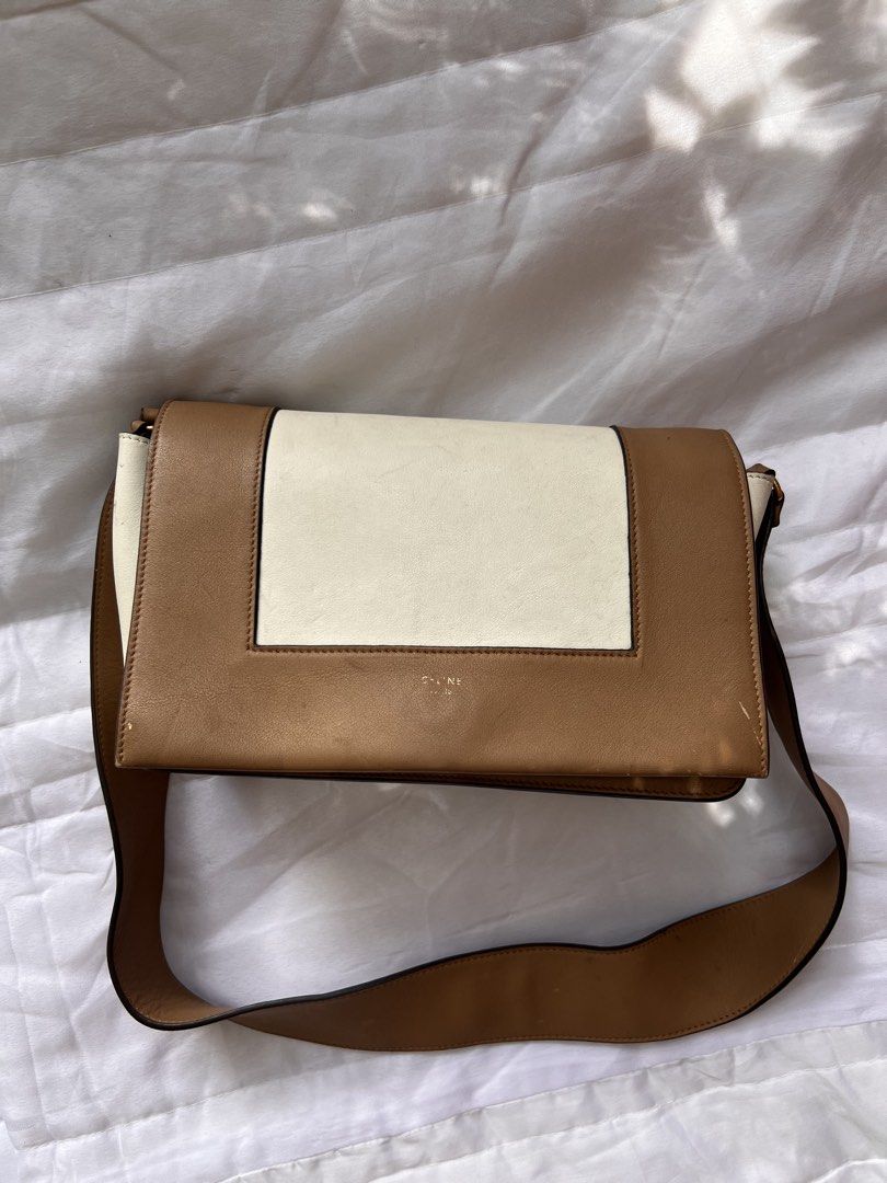 Celine Two-Tone Medium Strap Bag (Category: Luxury Bags & Wallets) located in Quezon City. Submitted by rizza14ortiz (Listing ID 1468527804, Image 1). Description: - Brand: Celine - Style: Two-tone crossbody bag - Color: Tan and cream - Material: Premium leather with leather lining - Hardware: Gold-tone with engraved logo and front clasp closure - Interior: Includes a zip pocket and open compartments for daily essentials - Strap: Wide shoulder st