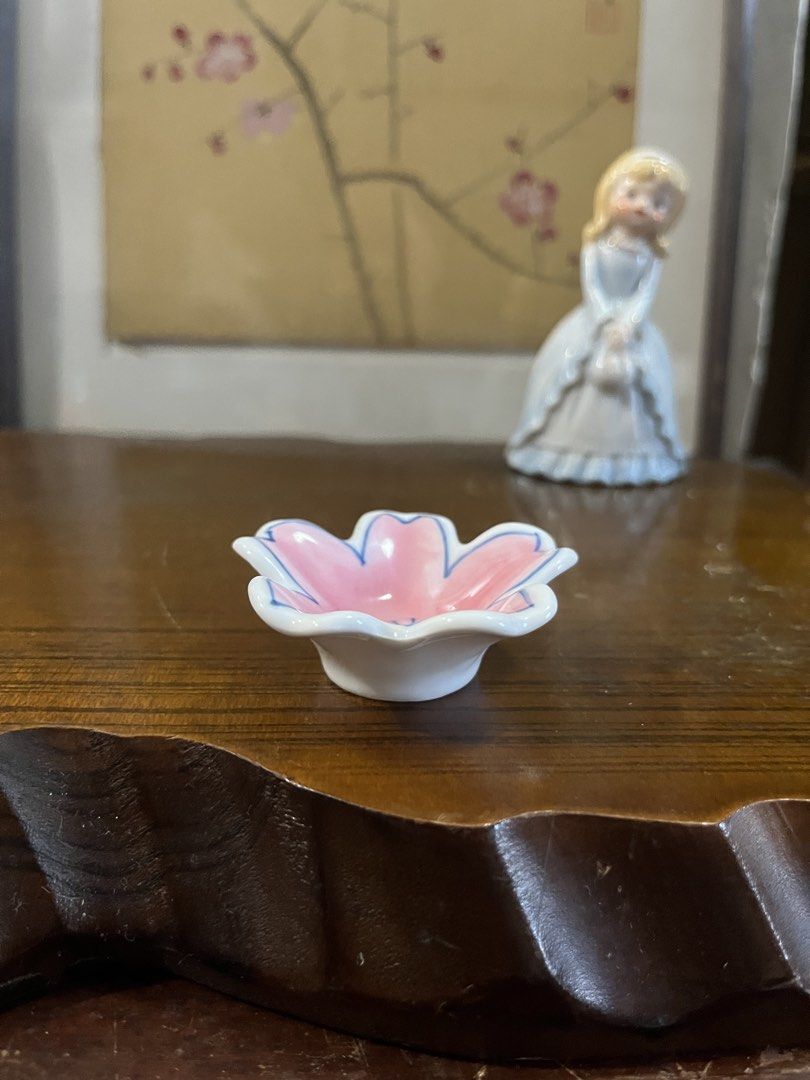 Ceramic Cherry Blossom Ring Dish Small Trinket Tray (Category: Dinnerware & Cutlery) located in Taguig. Submitted by minmin_parker (Listing ID 1468537277, Image 1). Description: - Adorable pink cherry blossom ceramic dish - Measures roughly 2.5 inches across - Hand-painted blue petal outlines with center stamens - Smooth white base underneath - Perfect trinket tray for rings, earrings, and small daily jewelry.