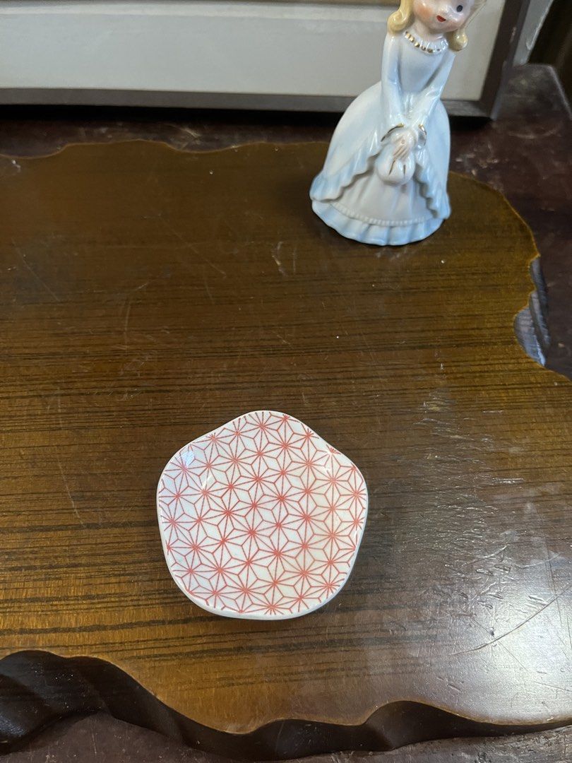 Ceramic ring dish pink geometric pattern (Category: Dinnerware & Cutlery) located in Taguig. Submitted by minmin_parker (Listing ID 1468537480, Image 3). Description: - Type: Small ceramic trinket dish - Design: Red geometric pattern on top with a clean white underside and base - Size: Approximately 2.5 inches across - Uses: Ideal for organizing rings, earrings, and other small accessories.