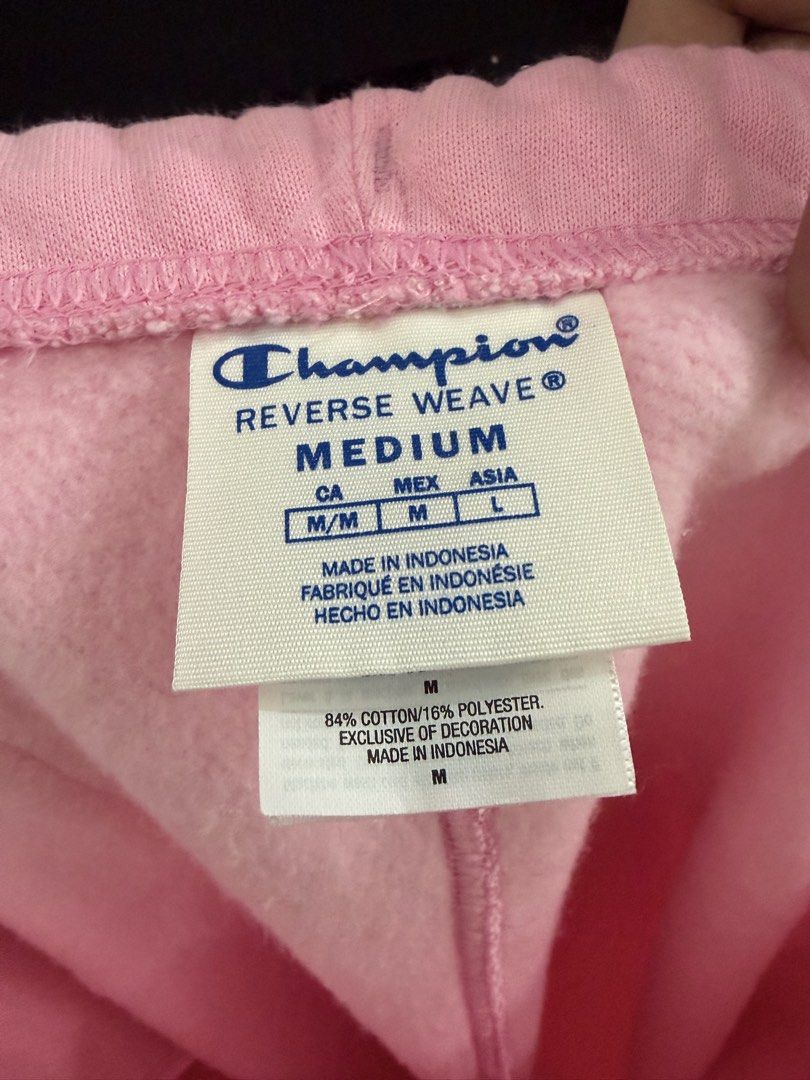 Champion Reverse Weave Candy Land Pink Sweatpants (Category: Other Bottoms) located in Manila. Submitted by xiestyleclothing (Listing ID 1468642433, Image 3). Description: - Brand: Champion Reverse Weave - Size: Medium - Color: Pink - Design: Vertical Candy Land graphics on left and lower right legs, with branding on the back pocket - Features: Elastic waistband, side pockets, and elastic ankle cuffs - Material: Cotton and polyester blend with a 