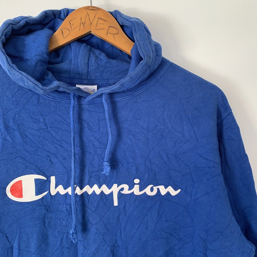 Champion Royal Blue Script Logo Hoodie X-Large (Category: Coats, Jackets and Outerwear) located in Manila. Submitted by gentleflower-74686a (Listing ID 1468502785, Image 2). Description: - Brand: Champion - 21.5 x 25 - Color: Royal Blue - Size: XL - Material: 100% Cotton - Design: Classic script logo on chest, small 'C' patch on left sleeve - Features: Kangaroo pocket, adjustable drawstring hood - Condition: Great casual piece for daily wear.