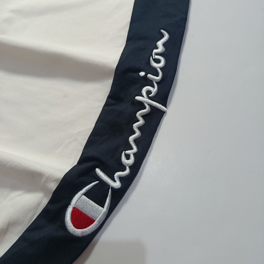 Champion White & Navy Side-Stripe Sweat Joggers (Category: Joggers) located in Taytay. Submitted by hoodgrail.vtg (Listing ID 1468606033, Image 3). Description: • Excellent condition - Lightly used • Embroidered Champion logos with bold navy side panels • Size on tag: XX-Large — best fits 28–31 • Measurements: 14 x 38 in • Leg opening: 4 in (elastic) • Color rate: 9/10 • Issue: None.