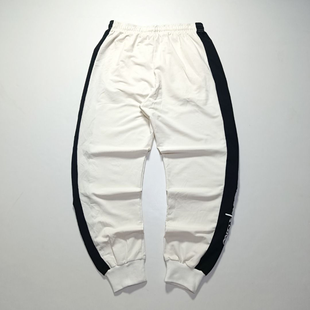 Champion White & Navy Side-Stripe Sweat Joggers (Category: Joggers) located in Taytay. Submitted by hoodgrail.vtg (Listing ID 1468606033, Image 2). Description: • Excellent condition - Lightly used • Embroidered Champion logos with bold navy side panels • Size on tag: XX-Large — best fits 28–31 • Measurements: 14 x 38 in • Leg opening: 4 in (elastic) • Color rate: 9/10 • Issue: None.