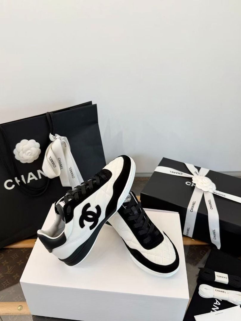 Chanel Black and White Quilted Leather Sneakers (Category: Sneakers) located in Navotas City. Submitted by stevensmit50068 (Listing ID 1468562811, Image 2). Description: - Brand: Chanel Sneakers - Color: Classic Black & White - Material: Quilted leather upper with suede mudguard - Details: Iconic interlocking CC logo on the side - Condition: Brand new, never worn out, clean soles - Inclusions: Original branded box, paper bag, dust bag, extra lace