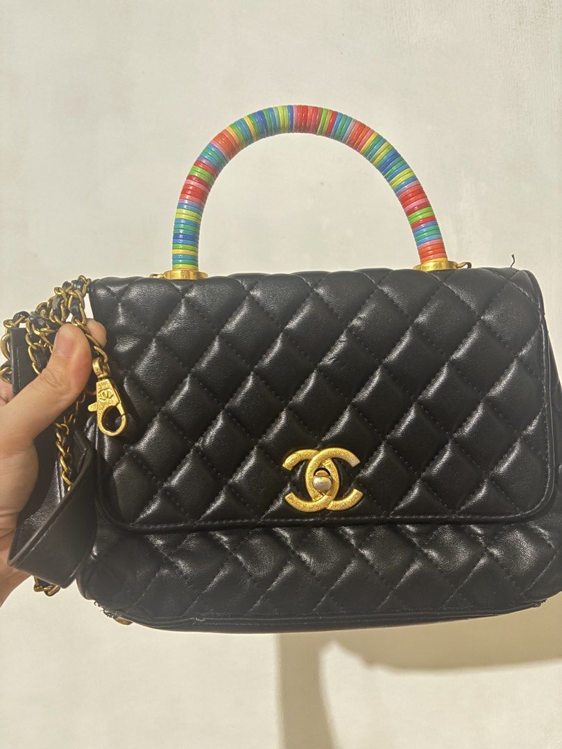 Chanel x Cambron OG cc underzip lambskin leather (Category: Luxury Bags & Wallets) located in Paranaque City. Submitted by GotUph (Listing ID 1468667853, Image 1). Description: - Brand: Chanel - Style: Quilted lambskin - Color: Classic black with pink interior lining - Handle: Coco handle bag super cool and unique multicolor stacked ring top handle - Strap: Included chain strap - Hardware: Gold-tone with iconic CC turn-lock closure - Interior: Zi