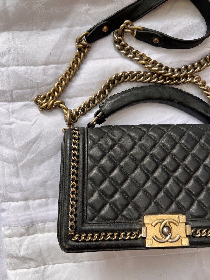 Chanel Boy Bag Black Quilted Leather (Category: Luxury Bags & Wallets) located in Manila. Submitted by mightylion-ce6ea7 (Listing ID 1468523069, Image 2). Description: - Brand: Chanel Boy Bag - Color: Black with aged gold-tone hardware - Material: Quilted leather - Features: Top handle, chunky chain strap with leather shoulder guard, and signature Chanel lettering on top hardware - Closure: Iconic CC push-lock front flap - Interior: Black leather
