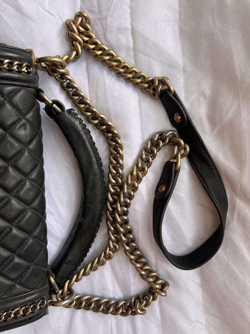 Chanel Boy Bag Black Quilted Leather (Category: Luxury Bags & Wallets) located in Manila. Submitted by mightylion-ce6ea7 (Listing ID 1468523069, Image 3). Description: - Brand: Chanel Boy Bag - Color: Black with aged gold-tone hardware - Material: Quilted leather - Features: Top handle, chunky chain strap with leather shoulder guard, and signature Chanel lettering on top hardware - Closure: Iconic CC push-lock front flap - Interior: Black leather