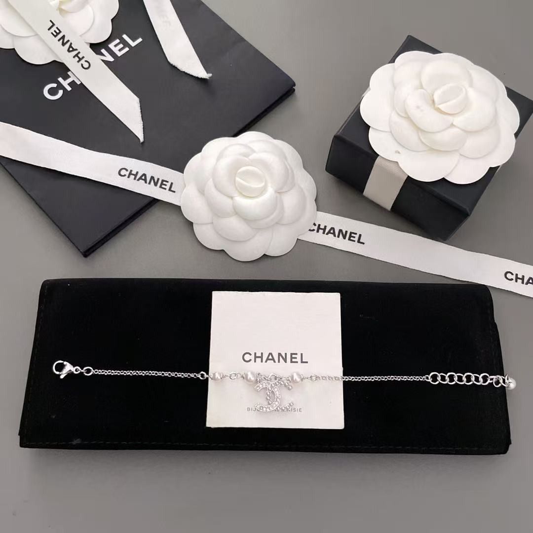 Chanel CC Pearl Crystal Silver Bracelet (Category: Bracelets) located in Pateros City. Submitted by purebird_714be0 (Listing ID 1468577608, Image 1). Description: - Authentic Chanel silver-tone chain bracelet - Features elegant pearl accents and a crystal-embedded interlocking CC charm - Adjustable length with a secure clasp closure - Includes complete original packaging: storage box, ribbon, paper bag, and felt pouch - Condition: Excellent, like