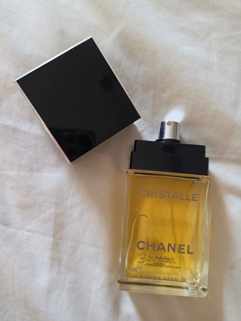 Chanel Cristalle Eau De Parfum 100ml (Category: Fragrance & Deodorants) located in Pasig City. Submitted by kwishhy (Listing ID 1468530884, Image 3). Description: • Brand: Chanel • Name: Cristalle Eau de Parfum • Fragrance Family: Floral Green (earthy, mossy, fruity, and ozonic accords) - Authentic Chanel Cristalle Eau de Parfum - 100ml bottle size, nearly full level - Tester unit - Elegant glass bottle with golden fragrance - Features a black ca